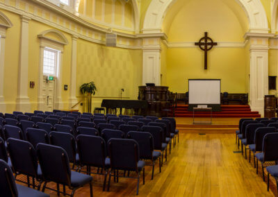 church in concert style facing the stage and screen